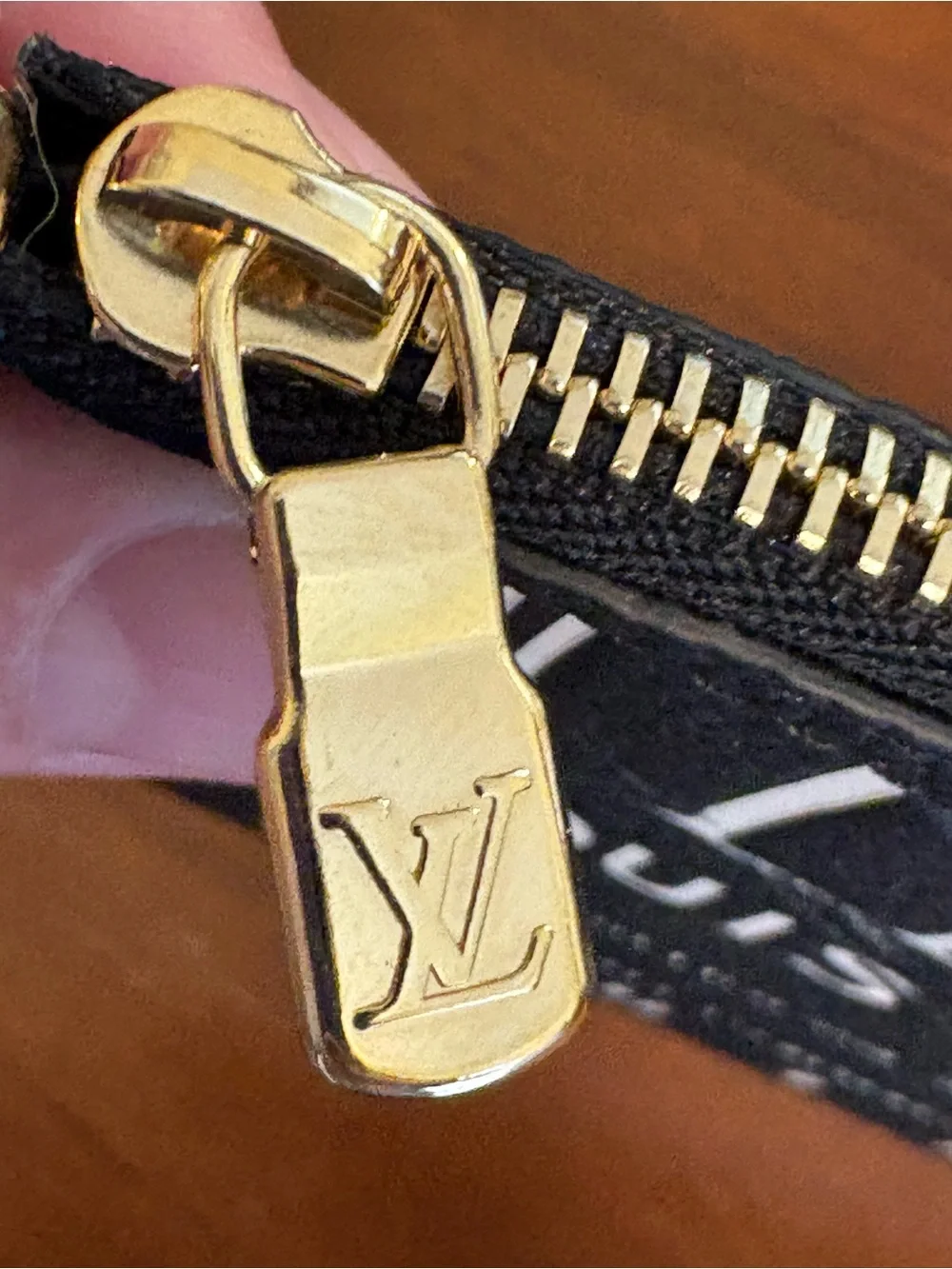 Louis Vuitton Black Pouch with Gold LV Zip Pull